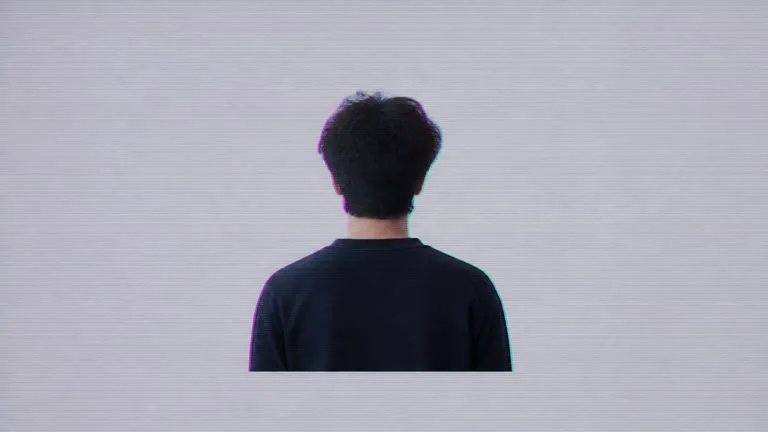 A portrait at subtle glitch intensity with fine scanlines and a light chroma split