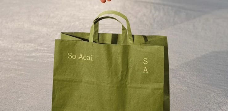 Olive canvas tote bag on textured stone