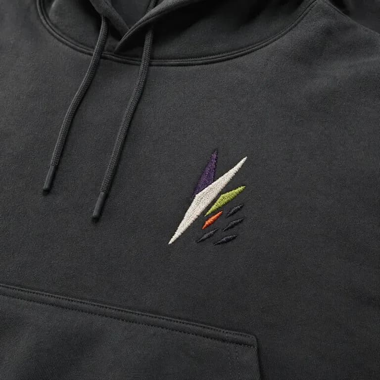 A close-up of an embroidered chest logo on a hoodie