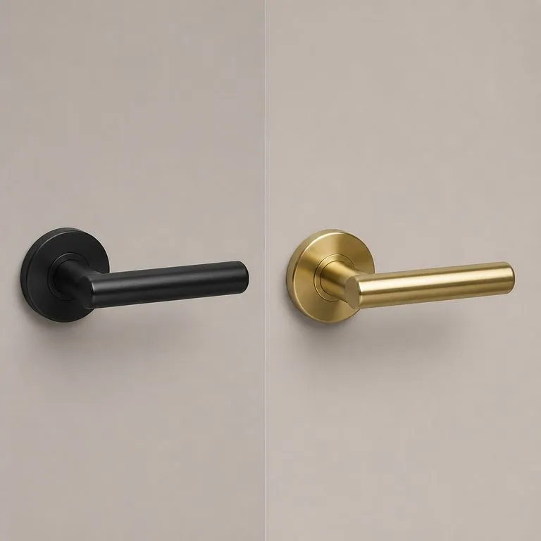 One door handle rendered twice, in matte black metal on the left and warm brass on the right