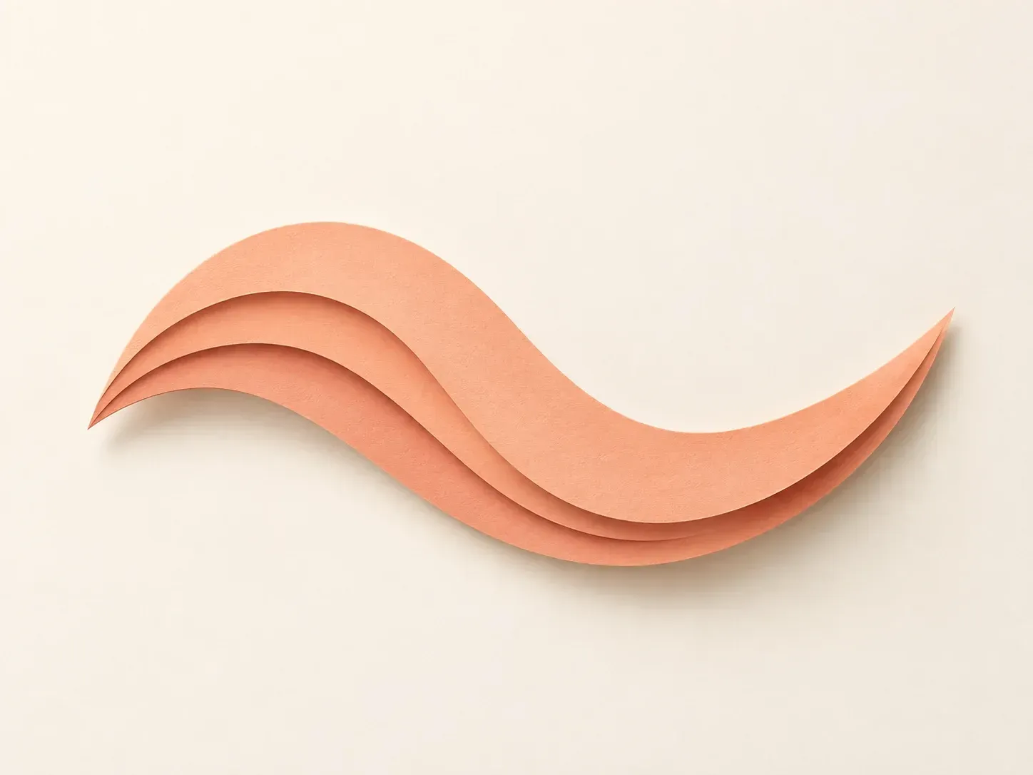 A peach paper-cut wave made from a text description