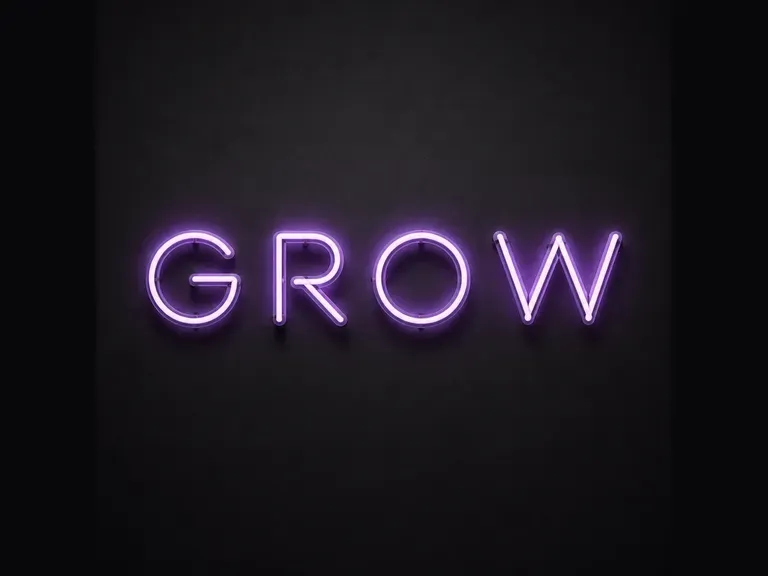 The word GROW in glowing neon